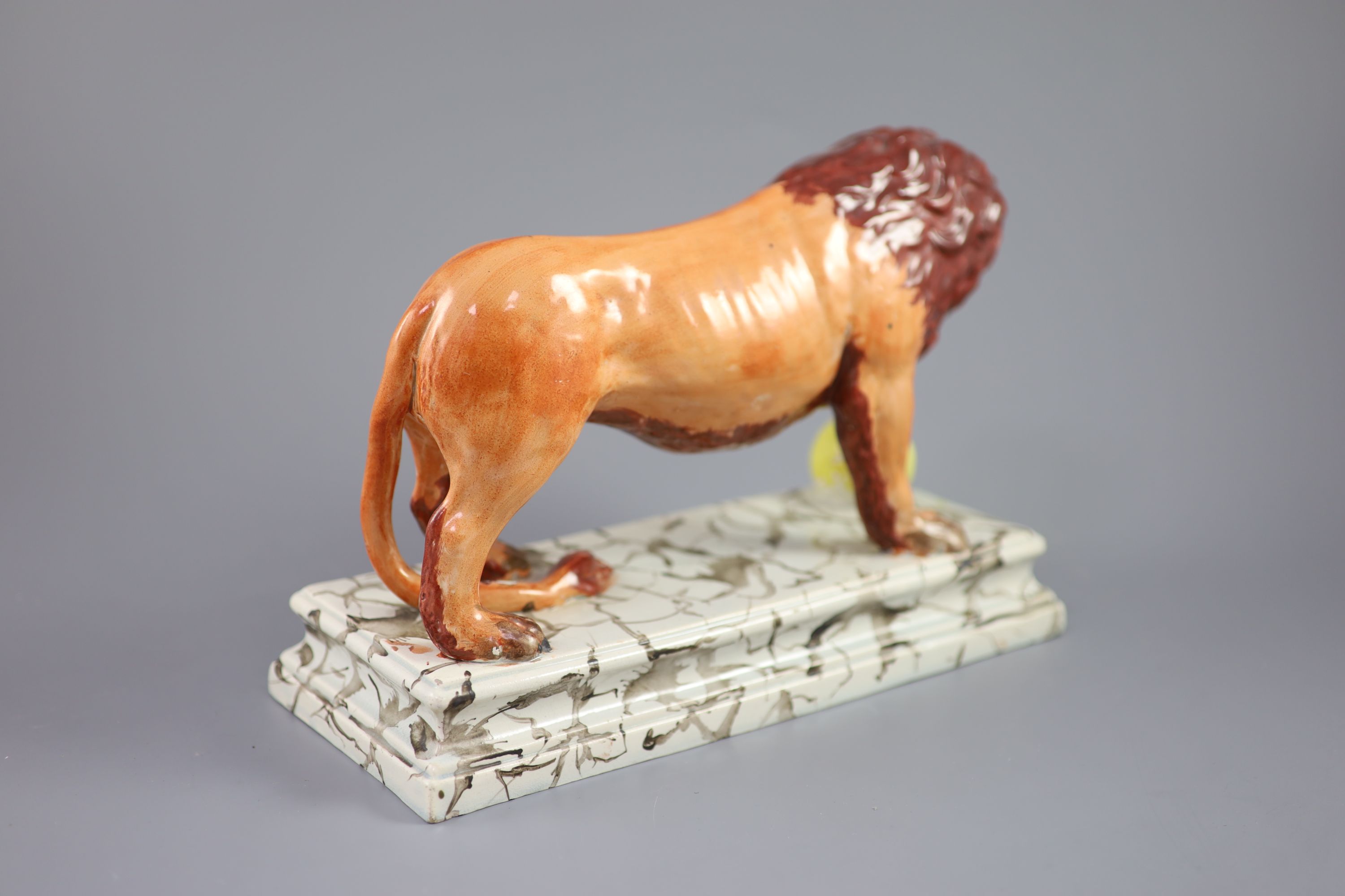 An Enoch Wood pearlware figure of a Medici Lion, c.1800-10, 28cm long